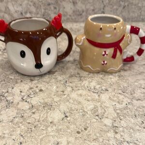 Festive Reindeer and Gingerbread Man Mugs. Not microwave safe.
